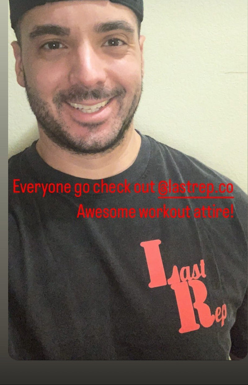 Man wearing a black Last Rep t-shirt with red Last Rep logo , smiling against a plain background.