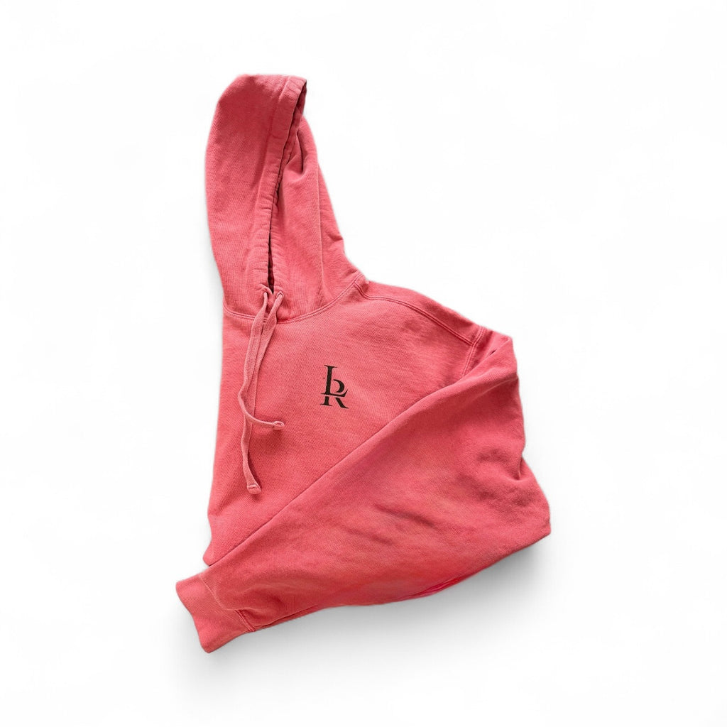 Pink/red hoodie with a logo on a white background