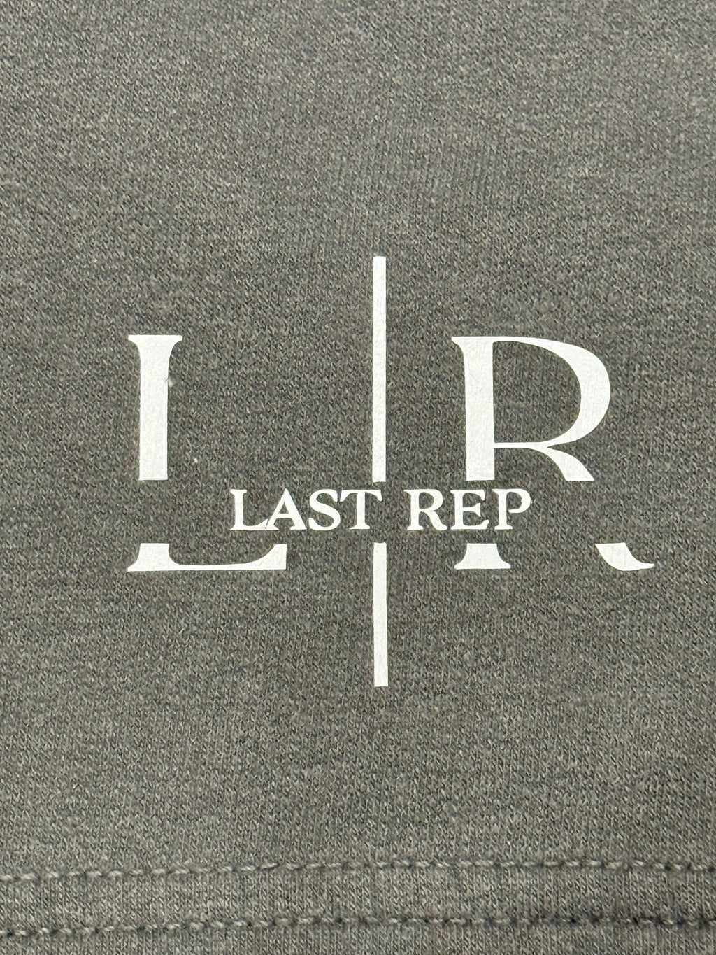 Gray fabric with 'LR Last Rep' logo printed on it