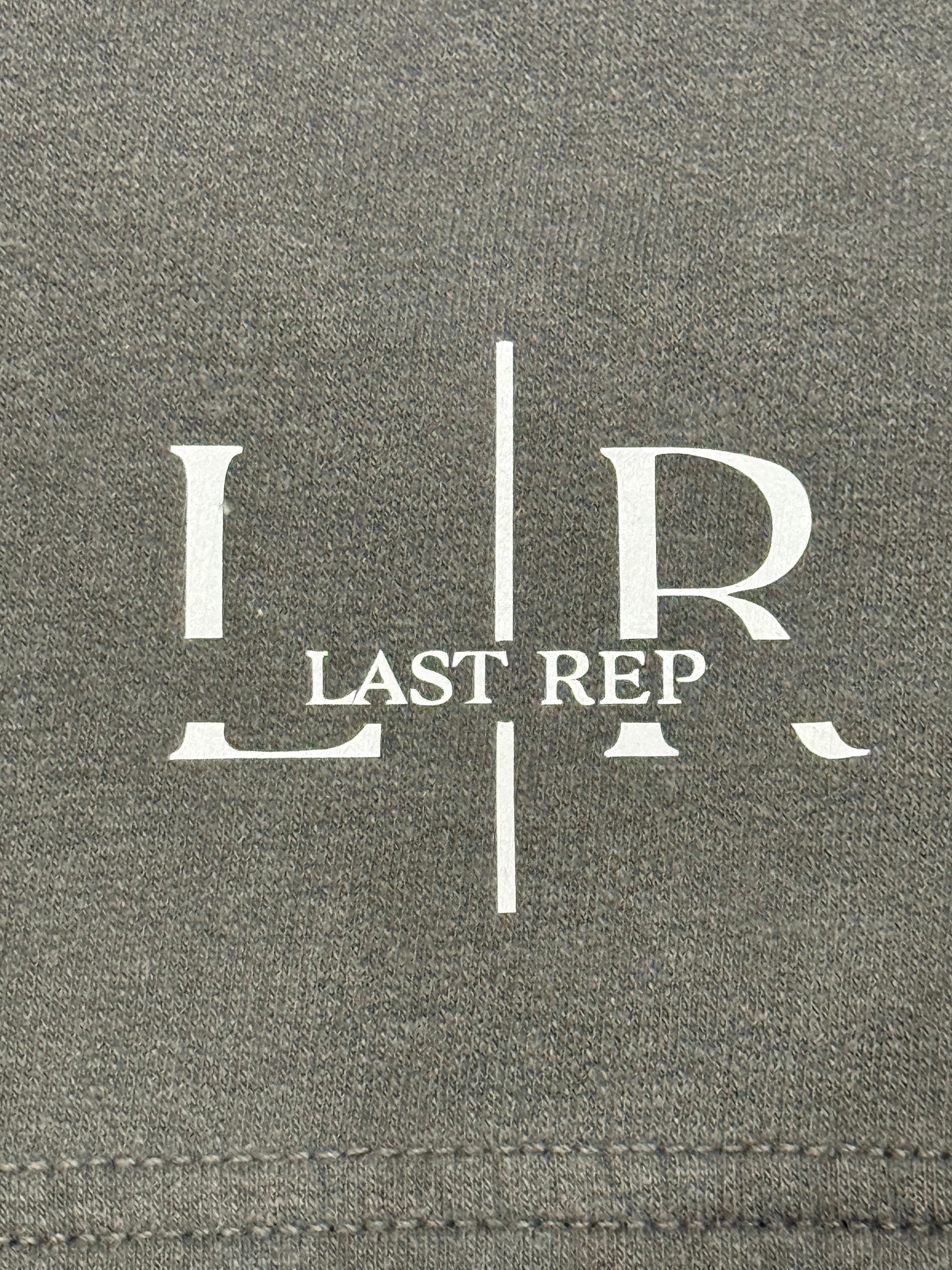 Gray fabric with 'LR Last Rep' logo printed on it