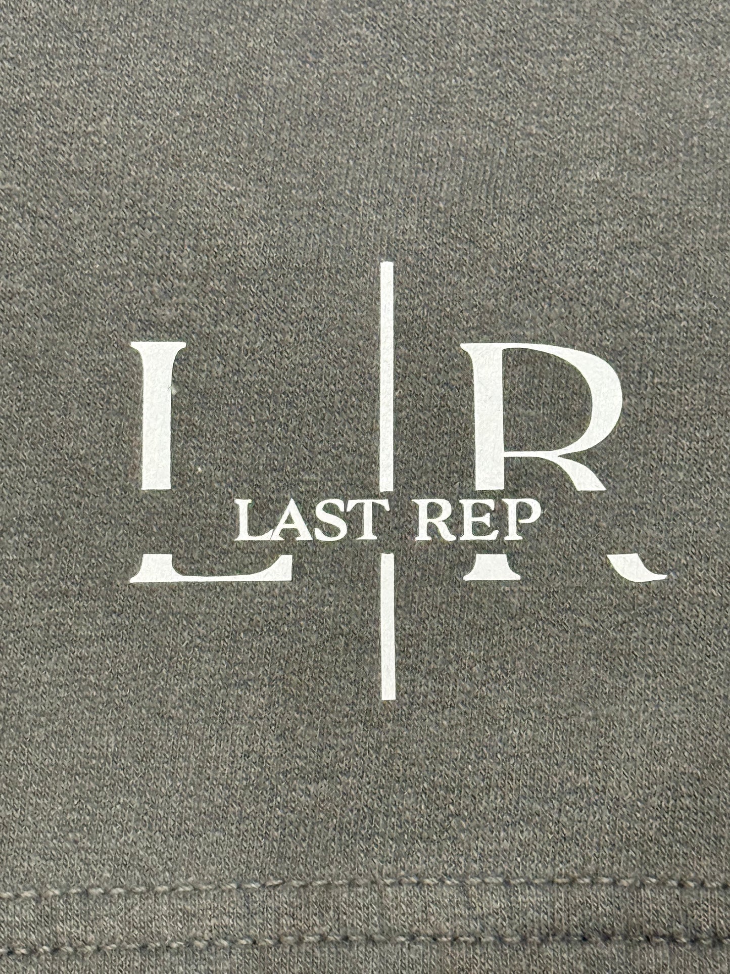 Gray fabric with 'LR Last Rep' logo printed on it