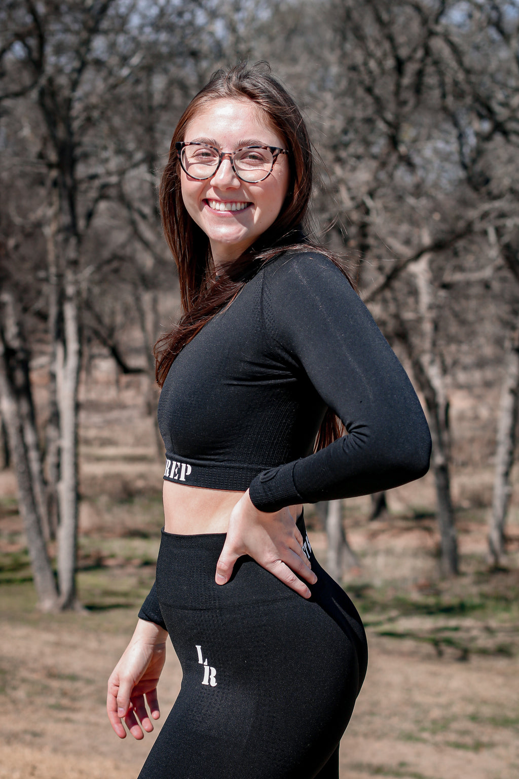 woman wearing black Last Rep crop long sleeve and leggings