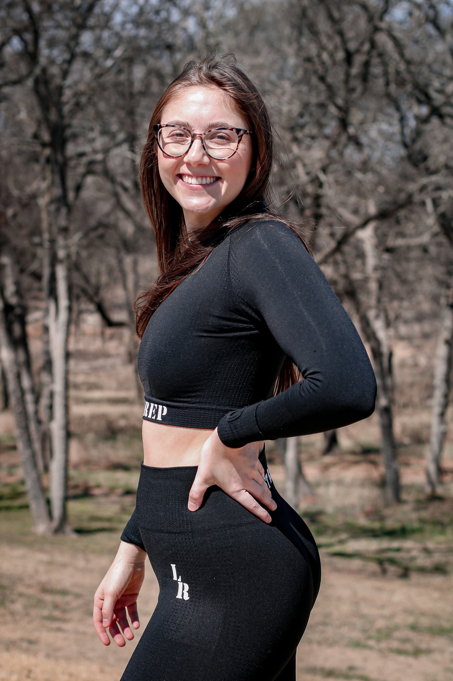 woman wearing black Last Rep crop long sleeve and leggings