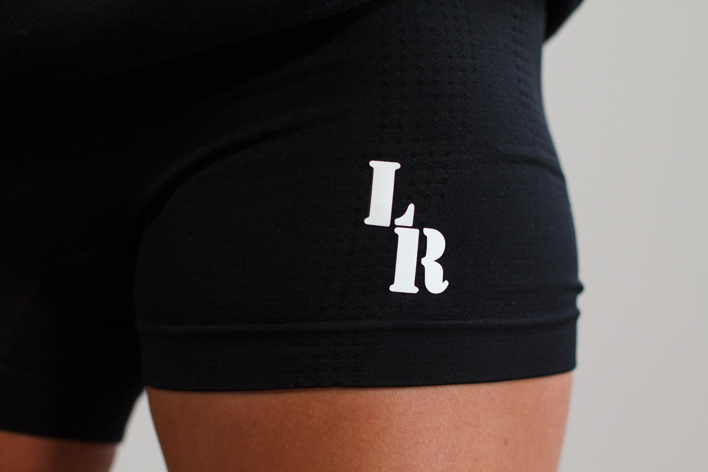 black Last Rep biker shorts with "LR"