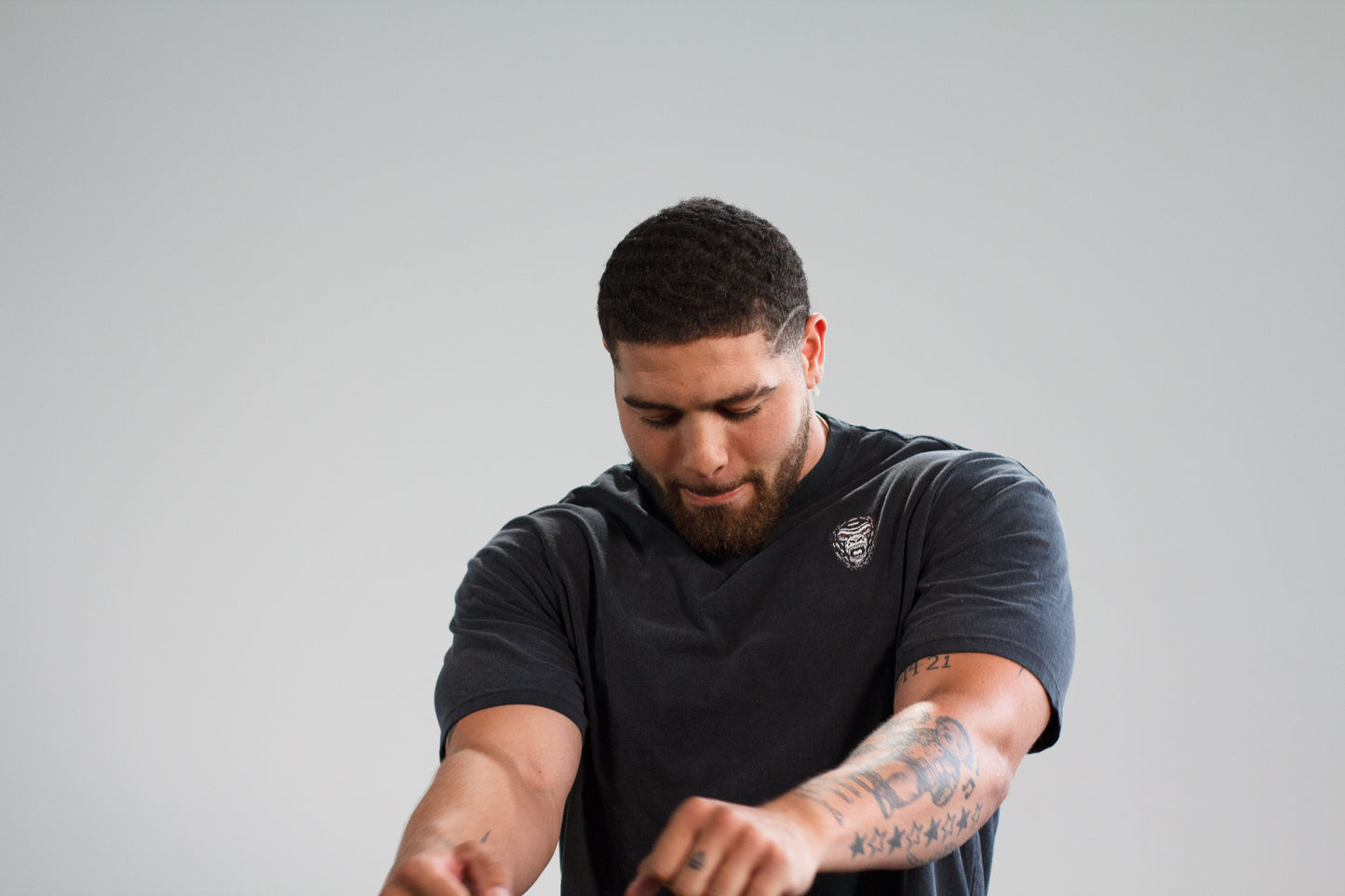 man modeling and dancing in last rep gym clothes