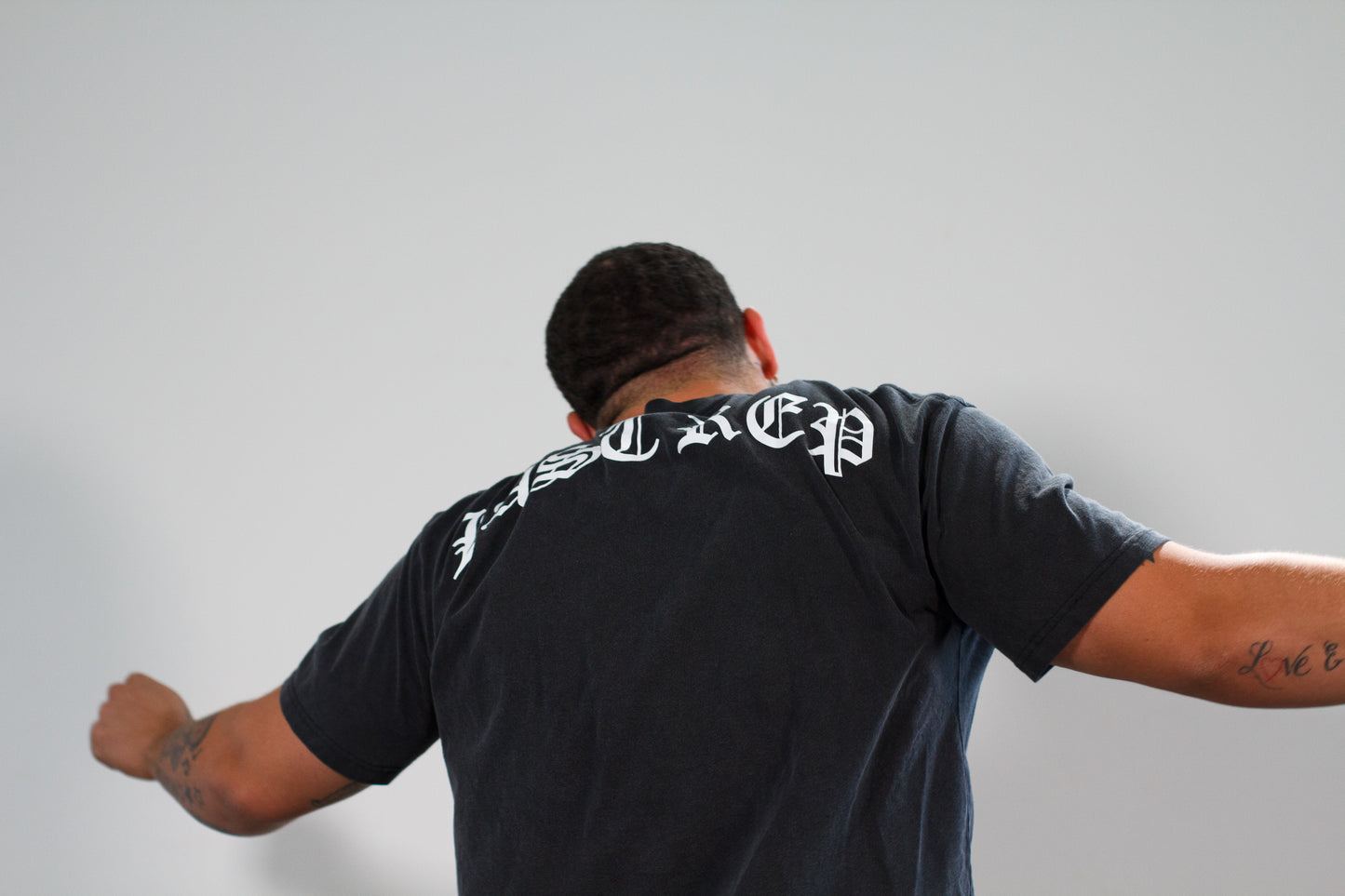 man dancing with last rep gym clothes