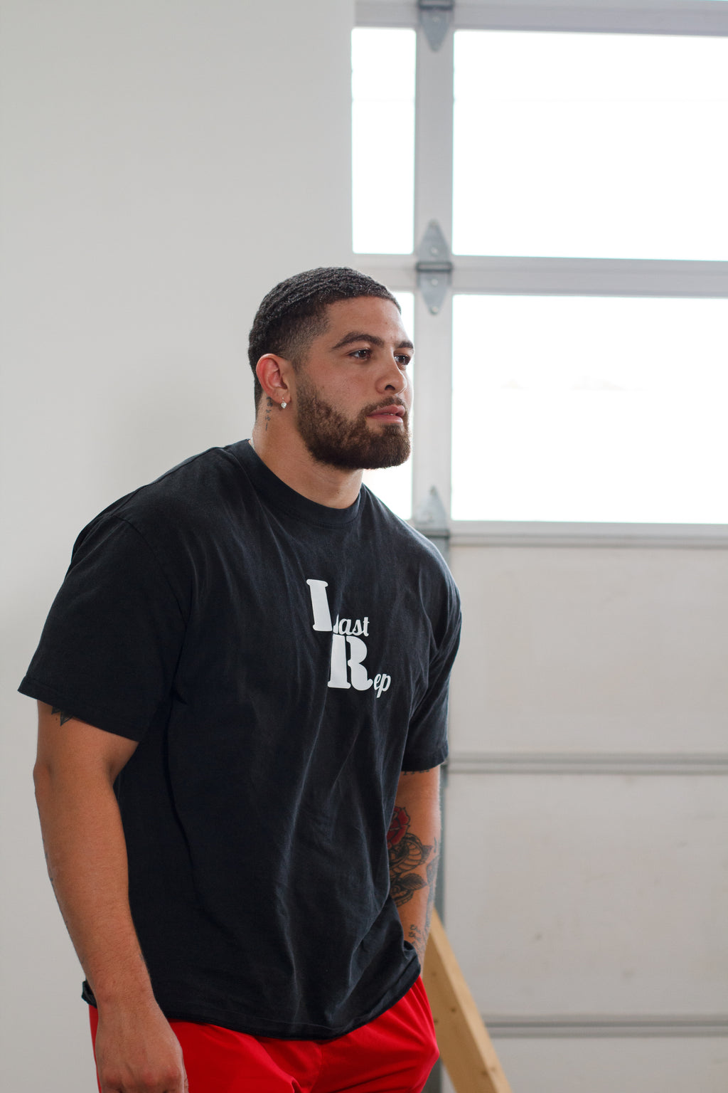 man posing with black Last Rep pump cover