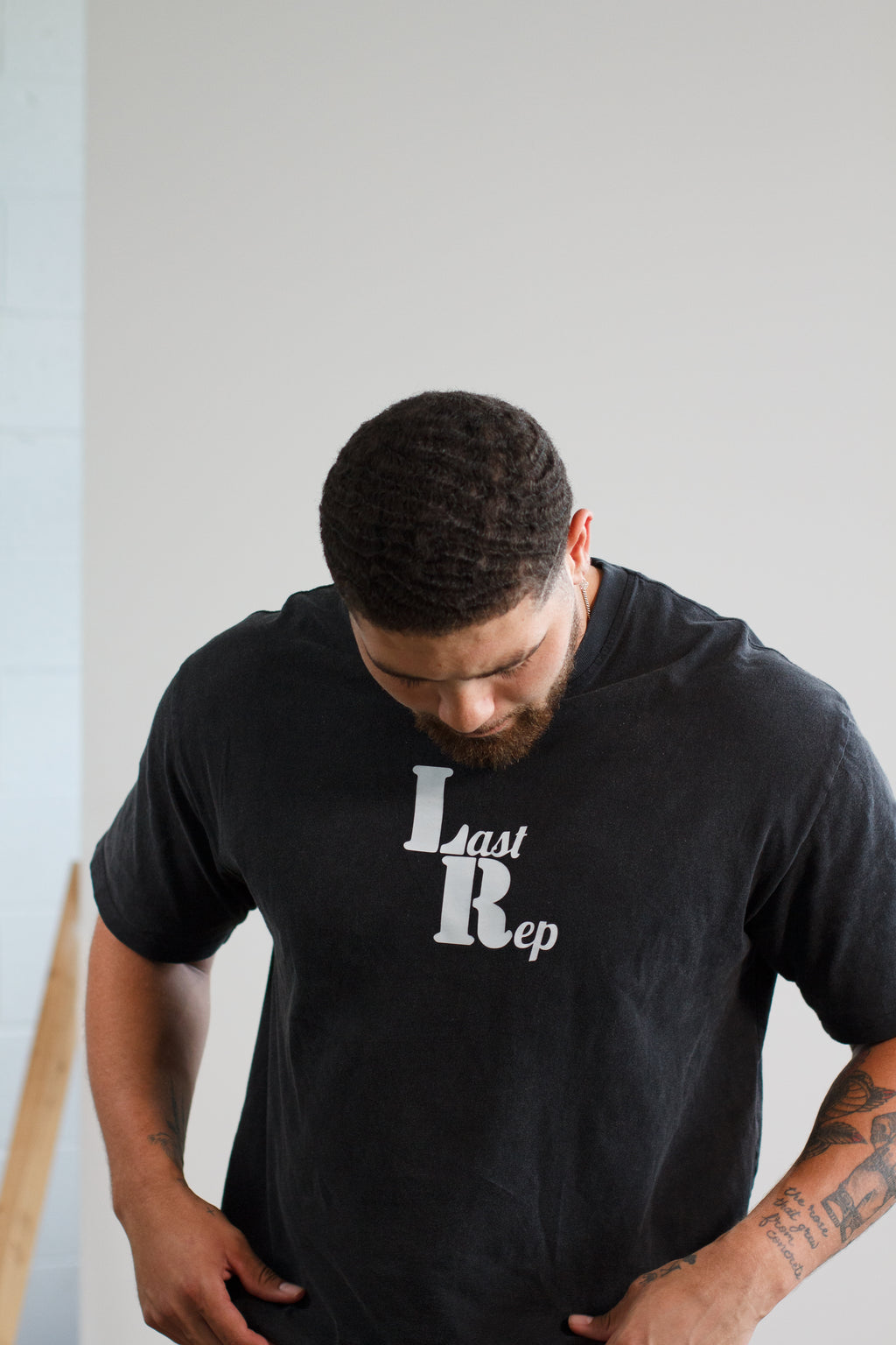 man wearing black Last Rep pump cover
